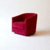 A contemporary soft, low armchair upholstered in a bold red wool. Design by DAVIDSON London. Side view.