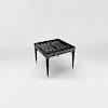 A sophisticated games table with an in-built chess, backgammon and card-playing area. Finished in a sycamore black with stylish tapered legs and a brushed brass trim and sabots. Design by DAVIDSON London.