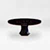 Black round Chatsworth Table on a grey background