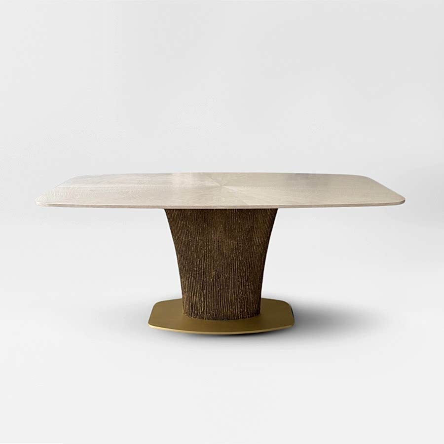 a cut out of the Magdon luxury bronze dining table on a light grey background with a soft shadow